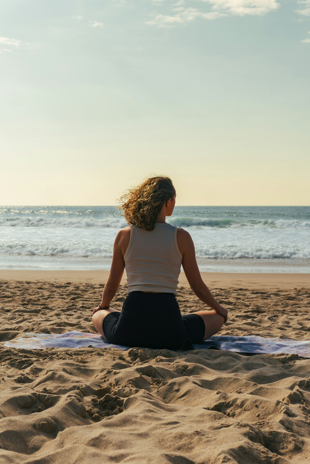 person meditating outdoors