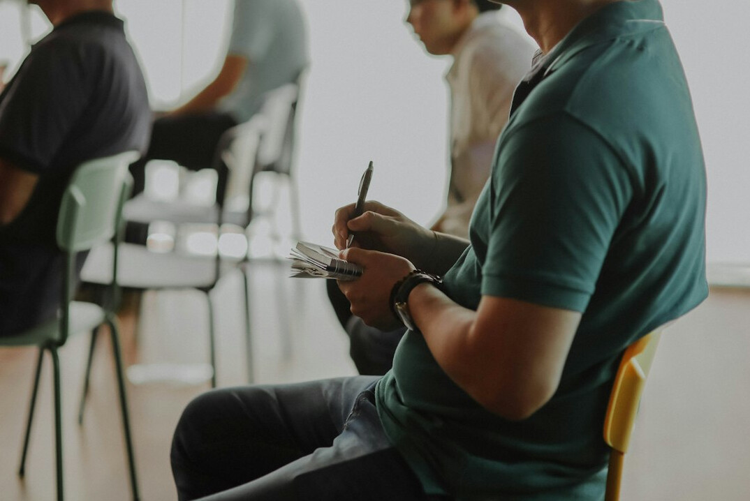 person giving feedback in meeting