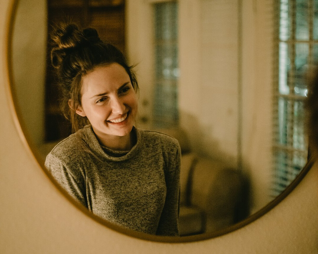 person practicing speech in mirror