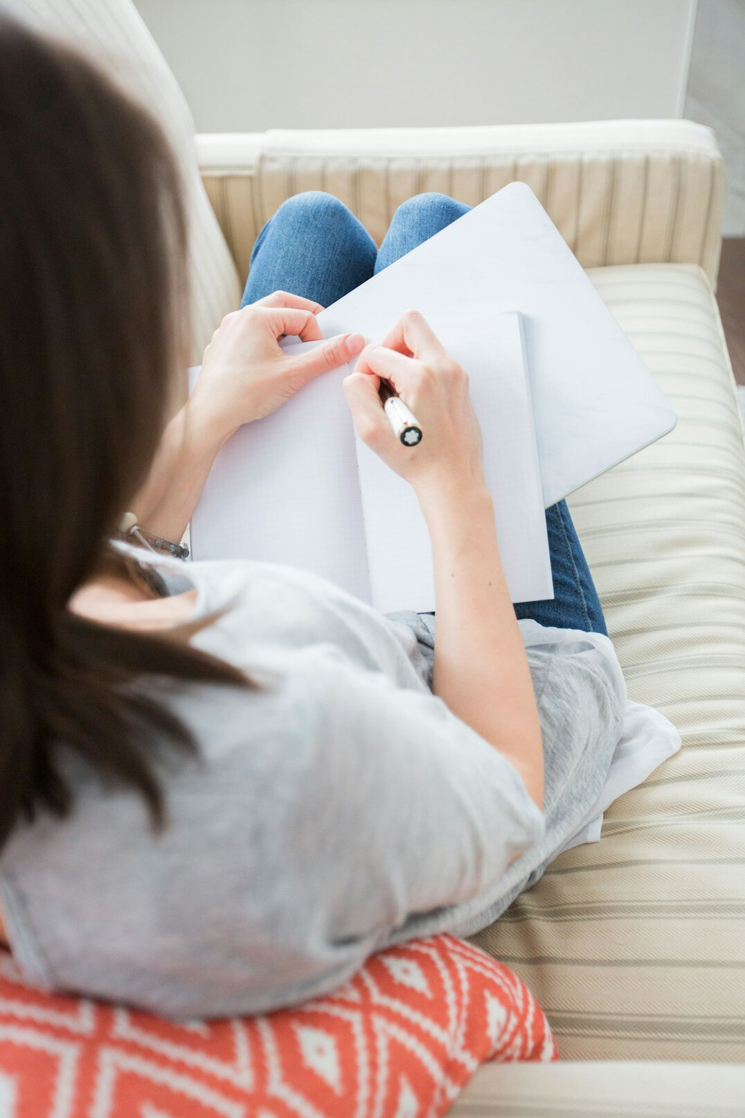 person journaling daily habits