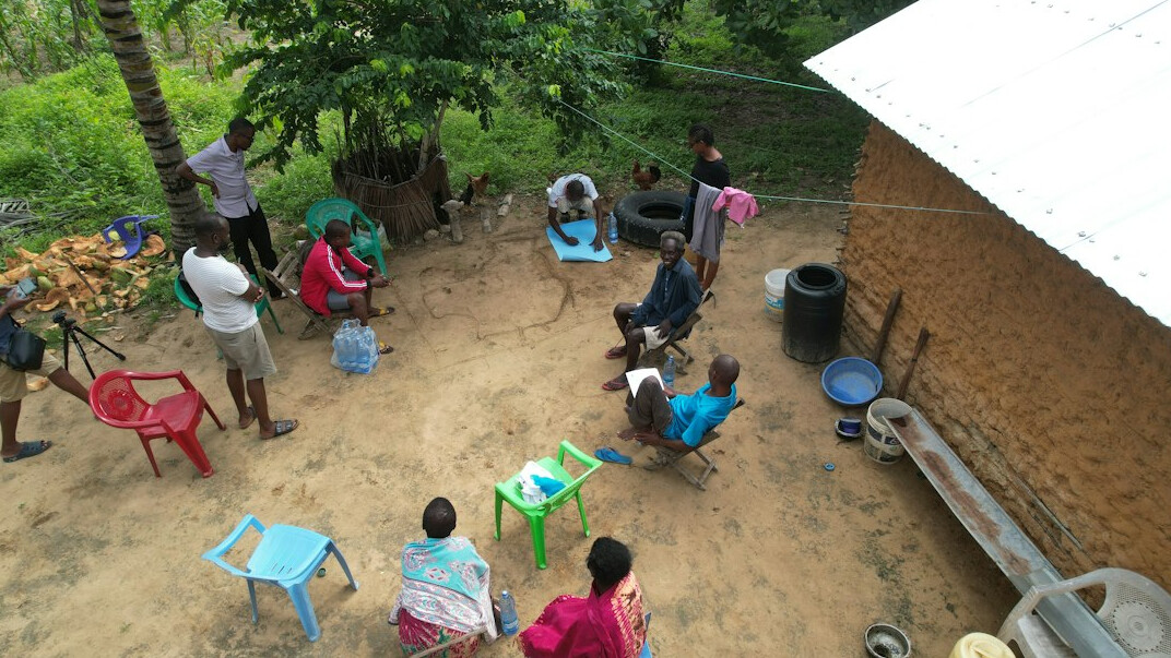 Group of people sitting in a circle talking