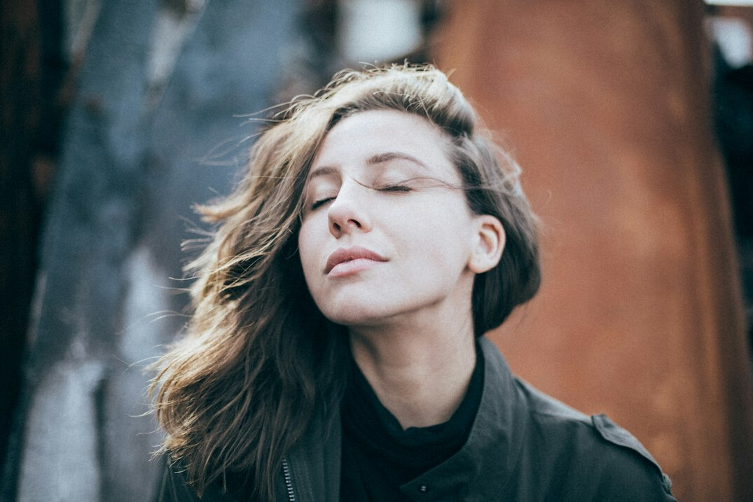 Woman meditating with eyes closed