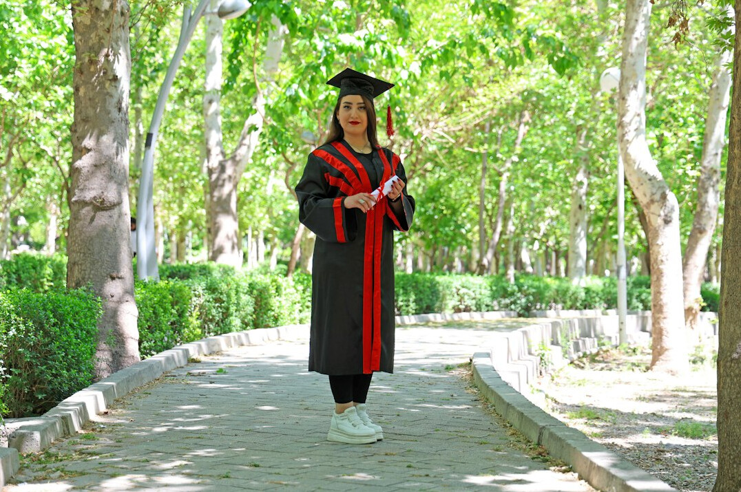 Person celebrating personal achievement outdoors
